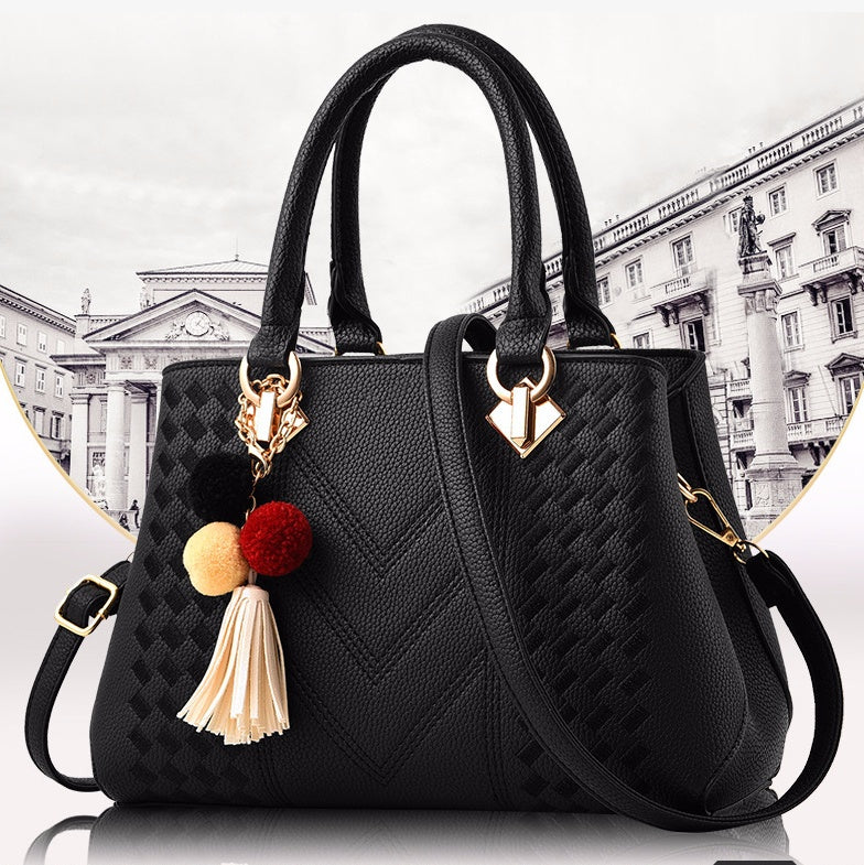 Bolso de mano de mujer con pompones y borla